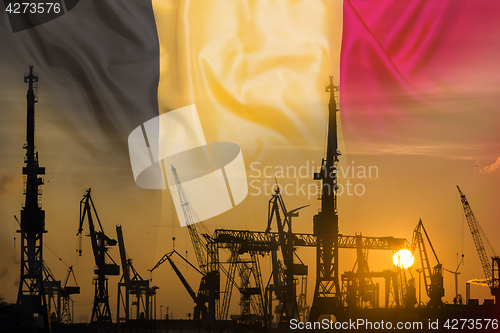 Image of Industrial concept with Belgium flag at sunset