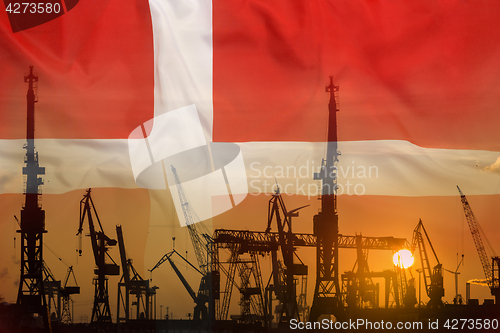 Image of Industrial concept with Denmark flag at sunset