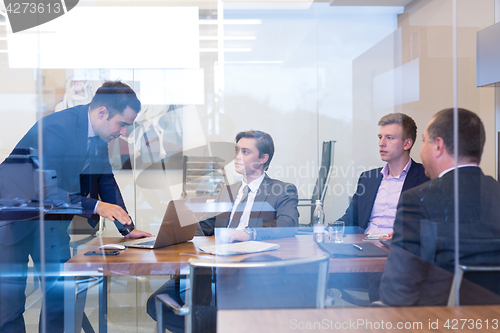 Image of Business people sitting and brainstorming at corporate meeting.