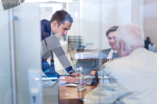 Image of Business people sitting and brainstorming at corporate meeting.