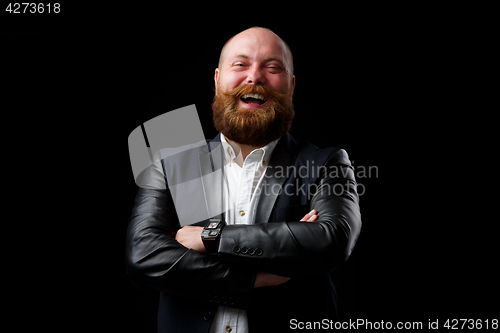 Image of Smiling man with arms crossed