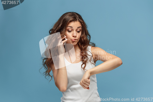 Image of The portrait of disgusted woman with mobile phone