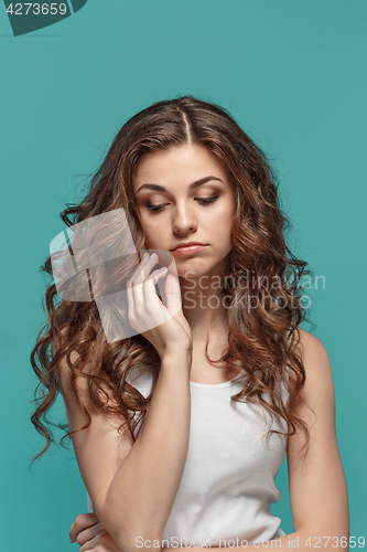 Image of The young woman\'s portrait with thoughtful emotions