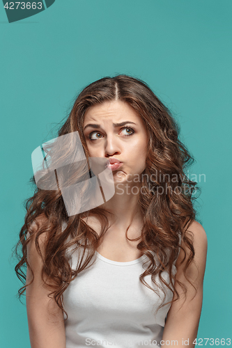 Image of The young woman\'s portrait with thoughtful emotions