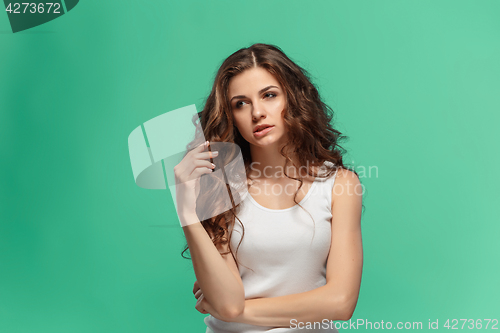 Image of The young woman\'s portrait with thoughtful emotions