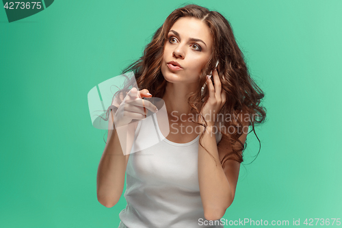 Image of Portrait of young woman with shocked facial expression