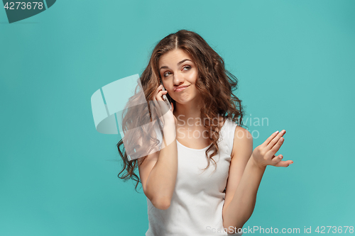 Image of The portrait of disgusted woman with mobile phone