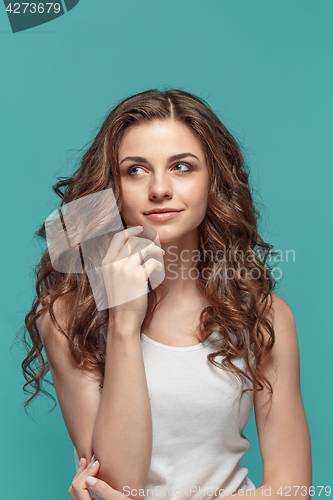 Image of The young woman\'s portrait with thoughtful emotions