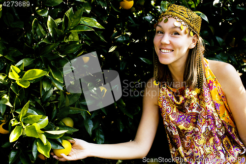 Image of pretty islam woman in orange grove smiling, real muslim girl che