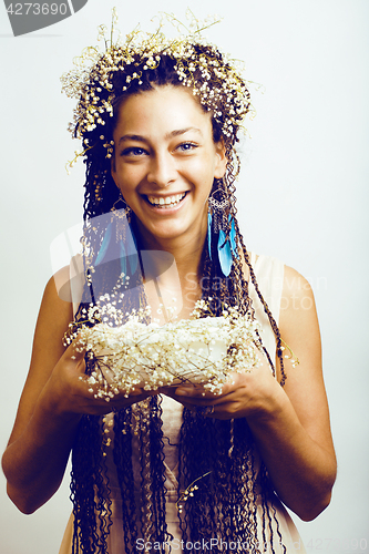 Image of young pretty brunette girl with bouquet of little white spring f