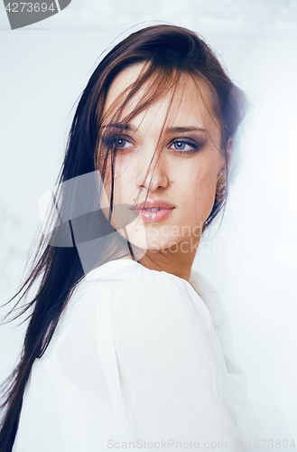 Image of beauty young brunette sad woman close up, nude makeup, lifestyle real people concept on white background blurred