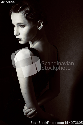 Image of beauty blond woman in studio on black background, stylish fashion retro vintage copyspace 