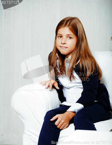 Image of little cute brunette girl at home interior happy smiling close u