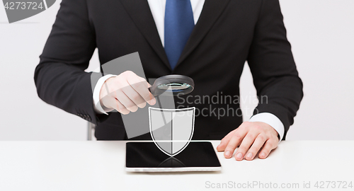 Image of businessman with tablet pc antivirus program icon