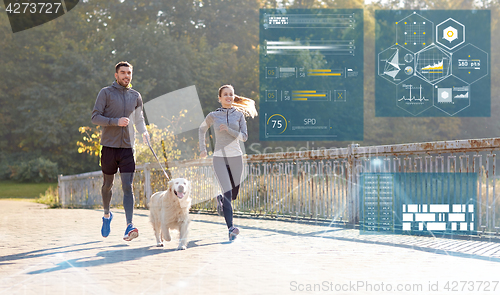 Image of happy couple with dog running outdoors