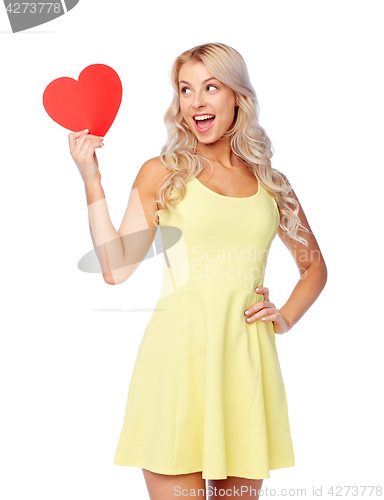 Image of happy young woman with red paper heart