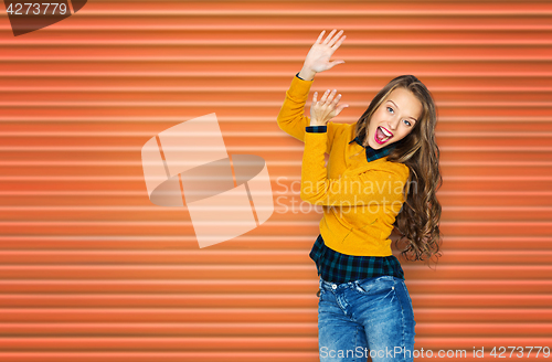 Image of happy young woman or teen girl applauding