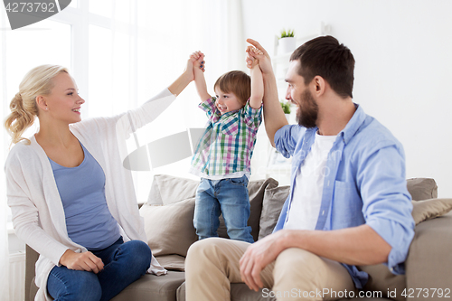 Image of happy family having fun at home