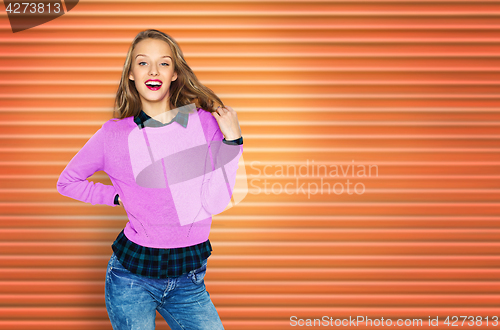 Image of happy young woman or teen girl in casual clothes