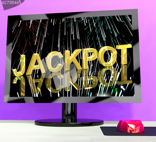 Image of Jackpot Word With Fireworks On Computer Showing Winning