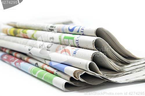 Image of Newspapers folded and stacked