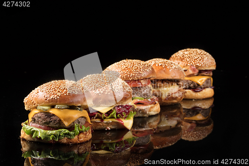 Image of Burgers On Black Glass