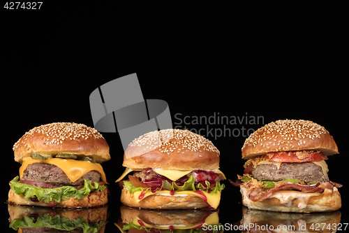 Image of Burgers On Black Glass