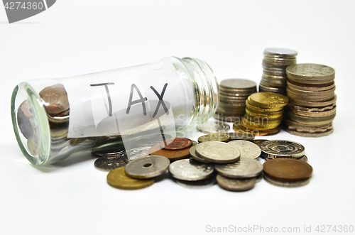 Image of Tax lable in a glass jar with coins spilling out
