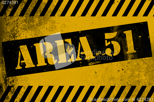 Image of Aea 51 sign yellow with stripes