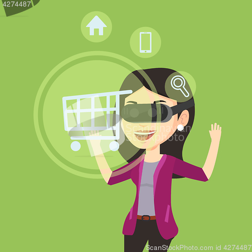 Image of Woman in virtual reality headset shopping online.