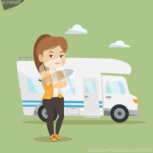 Image of Woman standing in front of motor home.