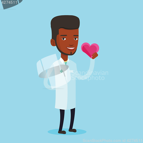 Image of Doctor cardiologist holding heart.