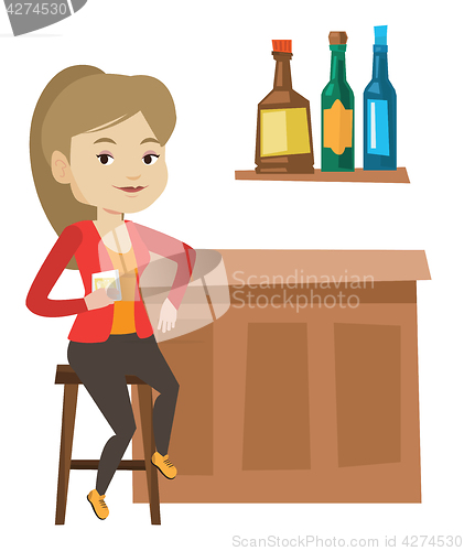 Image of Woman sitting at the bar counter.