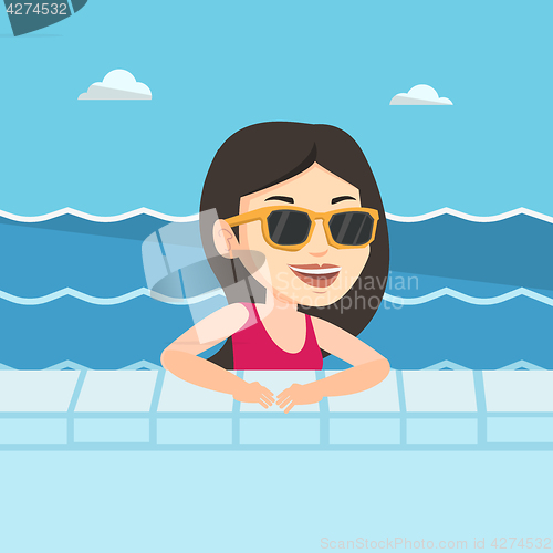 Image of Smiling young woman in swimming pool.