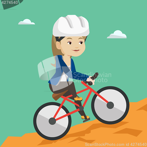 Image of Young woman on bicycle traveling in the mountains.