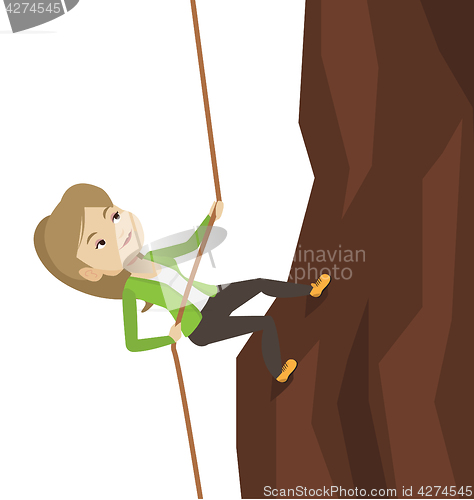 Image of Business woman climbing on the mountain.