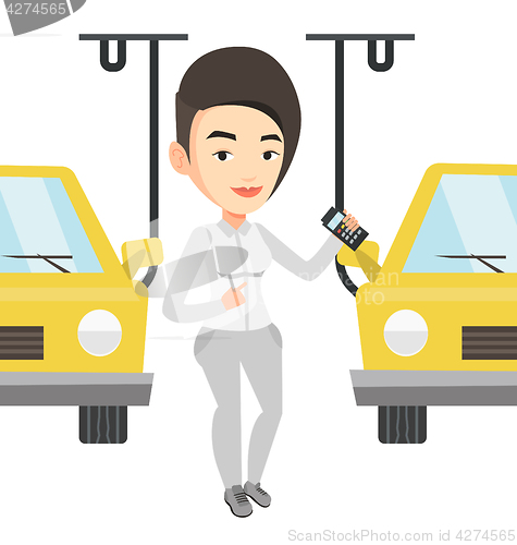 Image of Worker controlling automated assembly line for car
