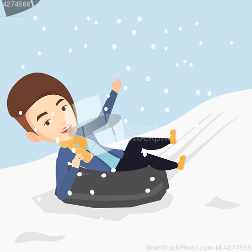 Image of Woman sledding on snow rubber tube in mountains.