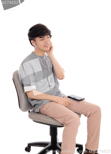 Image of Asian man enjoying the music.