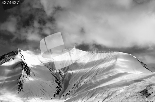Image of Black and white view on off-piste snow slope in evening