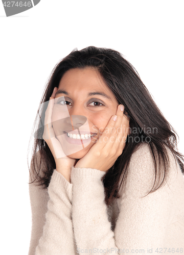Image of Happy woman holding her face in her hands.