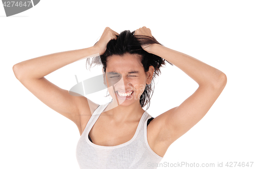 Image of Angry woman messing her hair.