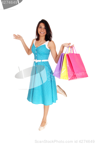 Image of Beautiful Hispanic woman with shopping bags.