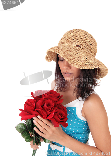 Image of Beautiful woman with bunch of red roses.