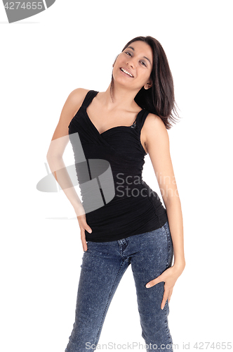 Image of Happy woman standing in jeans.