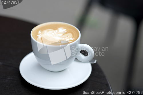 Image of view of cappuccino served on the table