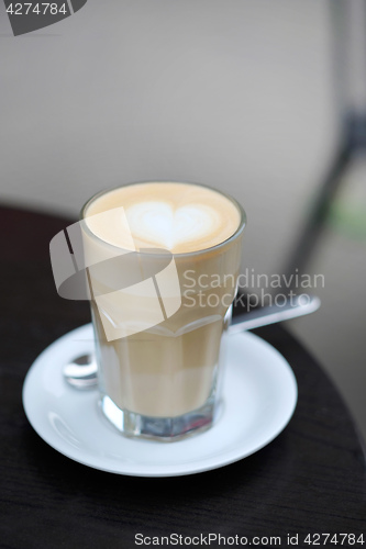 Image of view of coffee latte served on the table