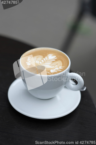 Image of view of cappuccino served on the table