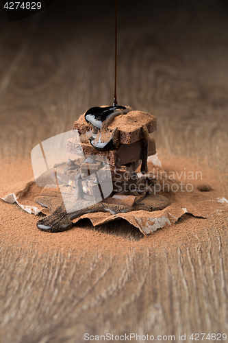 Image of Pieces of chocolate with syrup