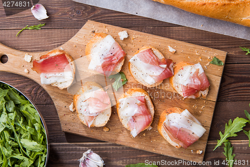 Image of Baguette with bacon with arugula